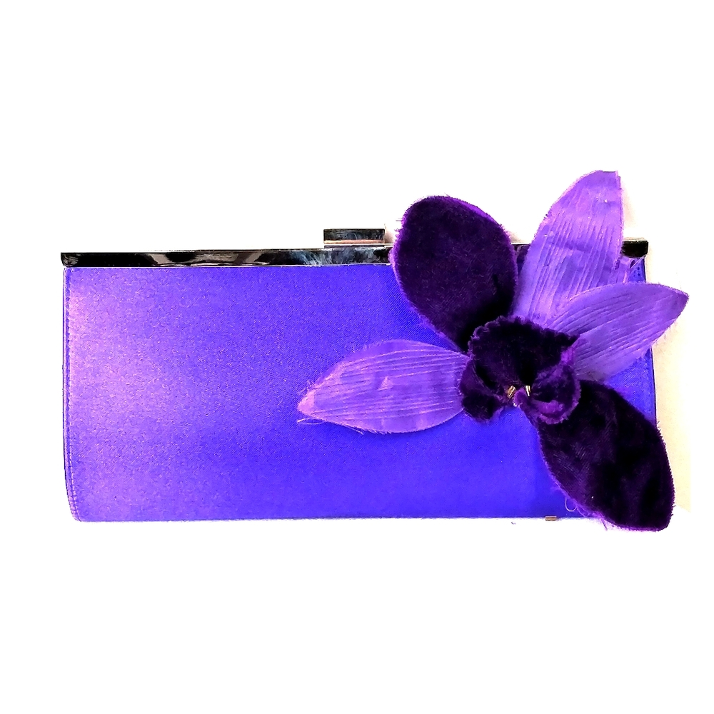 Purple structured clutch with vibrant colours, clasp, and chain strap